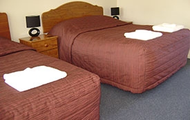 twin studio with one double bed and one single bed
